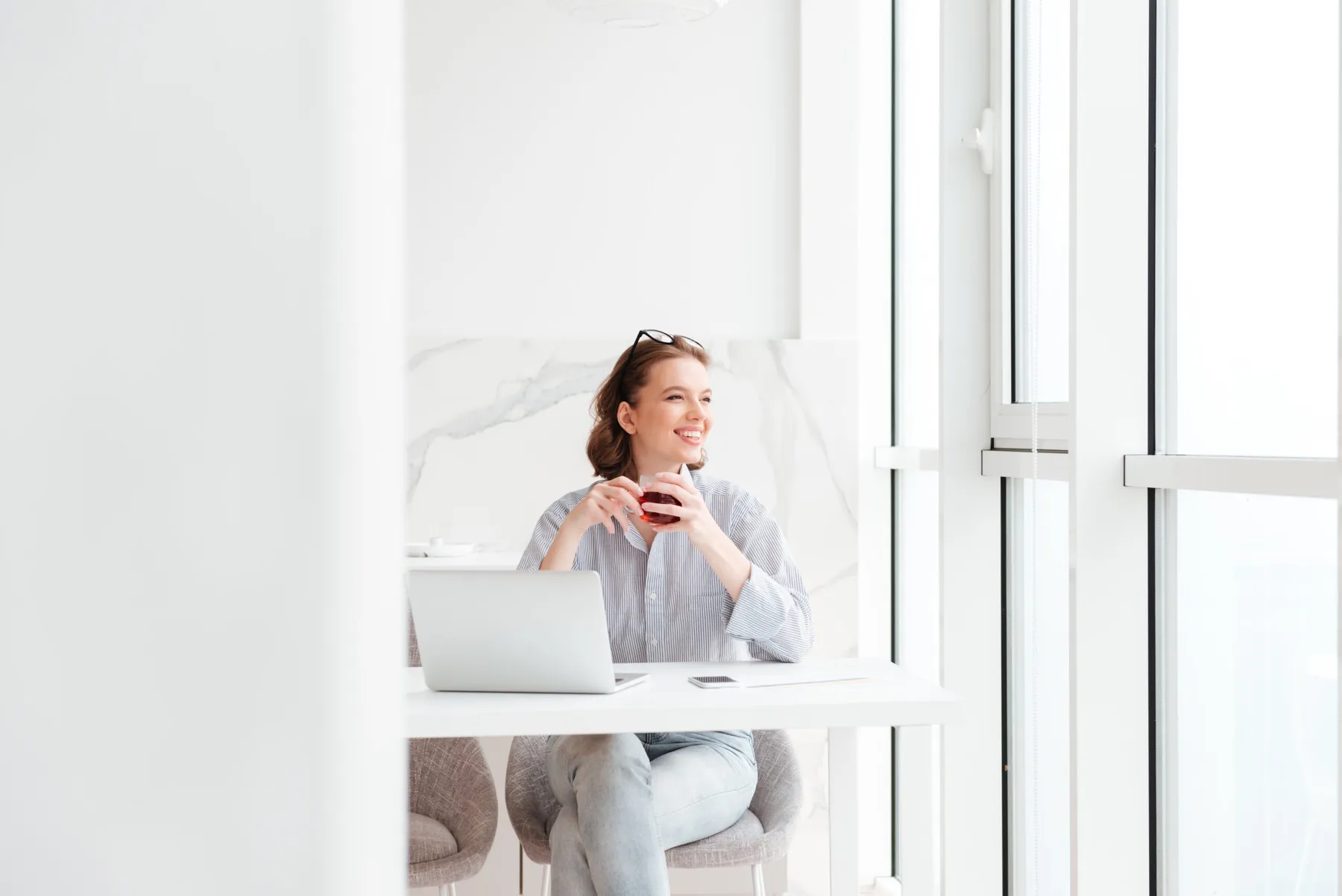 A calm moment by the window with a cup of tea